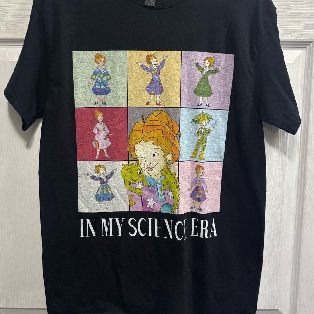 Black Graphic T-Shirt with Colorful Cartoon Panels of Mrs.Frizzle